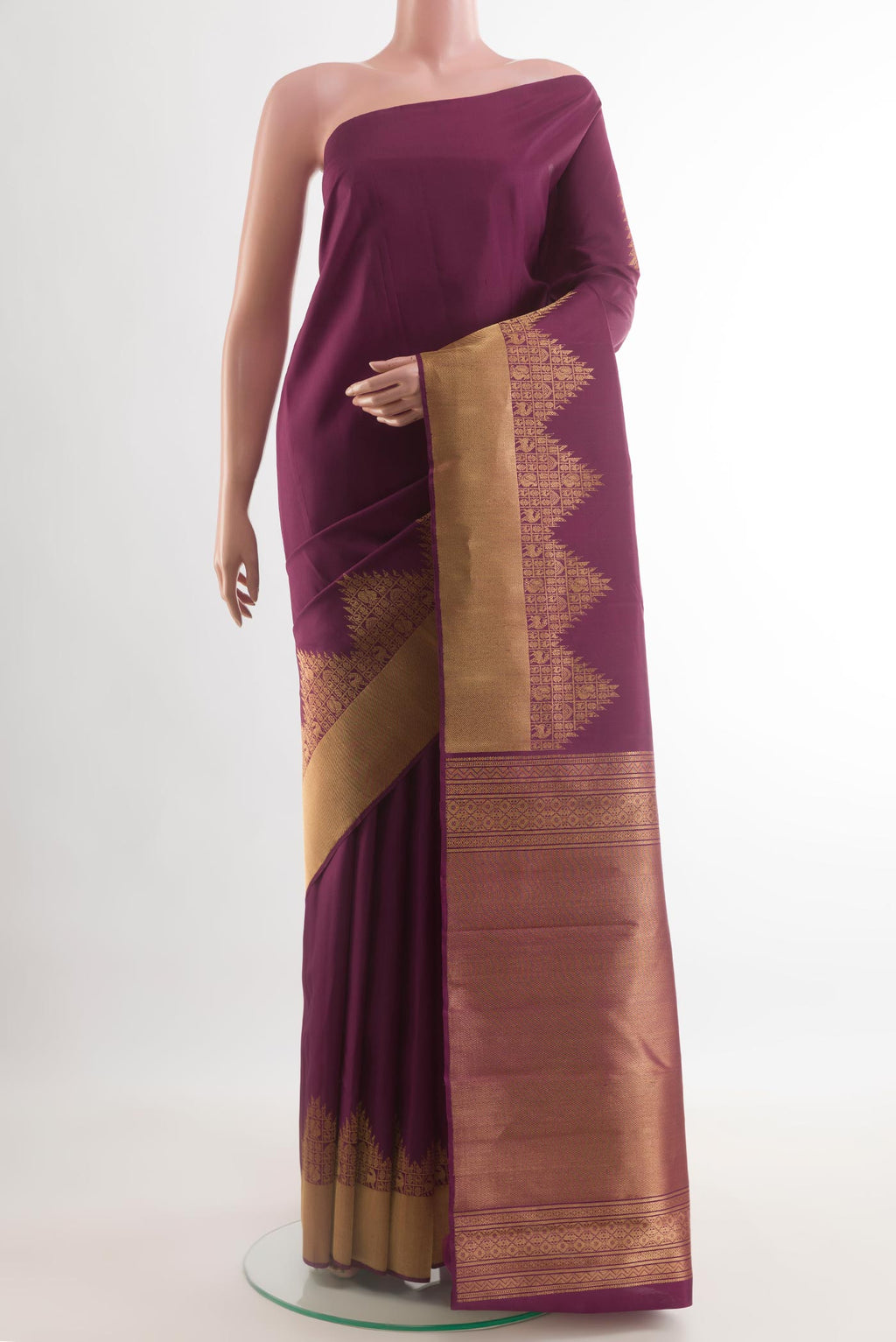 Purple Kanchipuram Silk Saree with Plain Body and Temple Border.  displayed on a mannequin