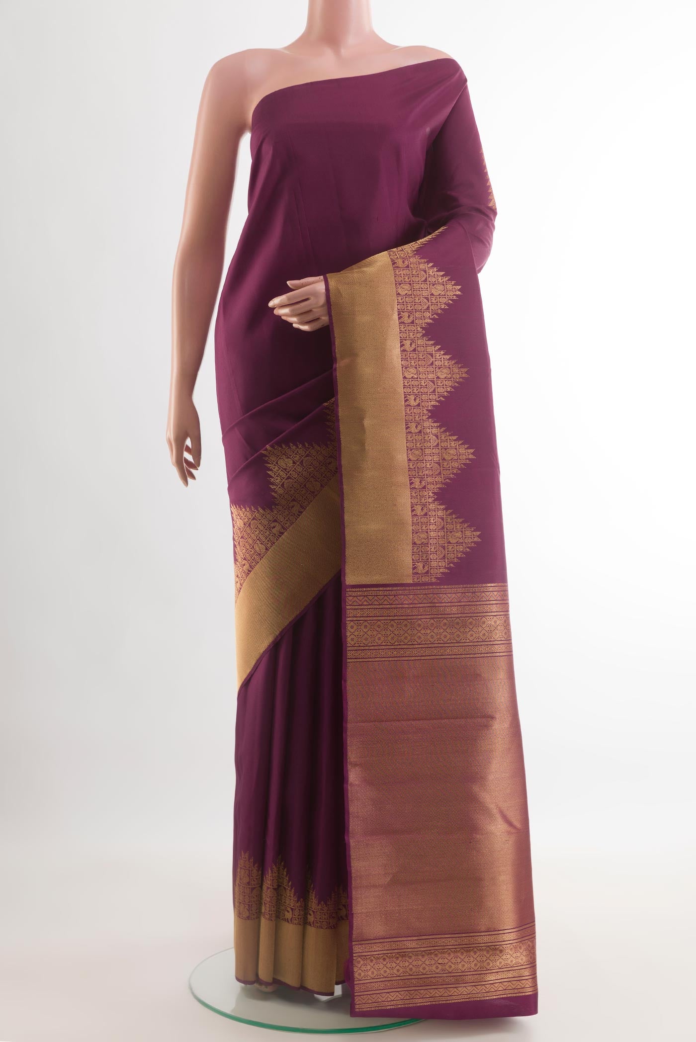 Purple Kanchipuram Silk Saree with Plain Body and Temple Border.  displayed on a mannequin