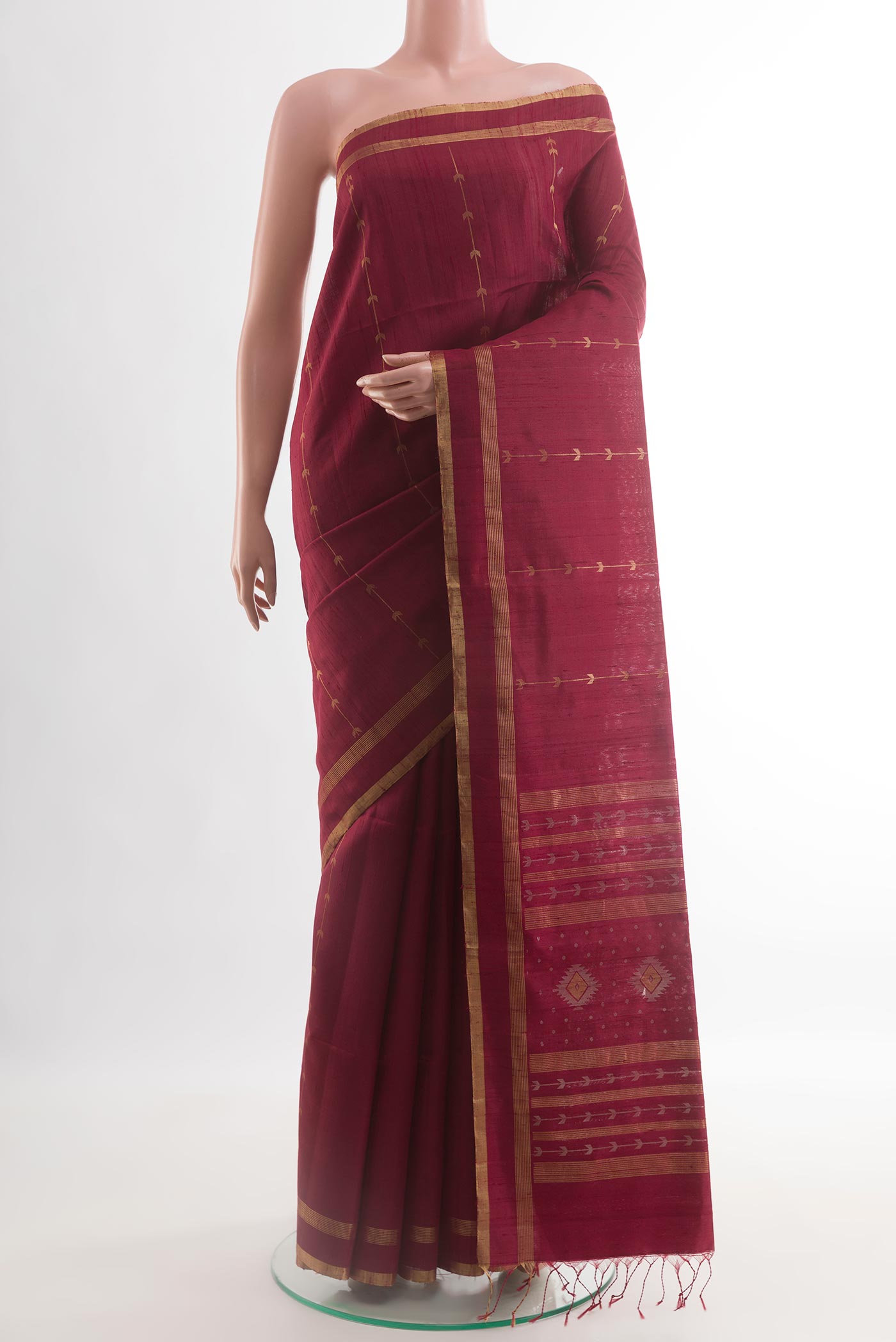 Maroon Raw Silk Saree with Stripes on the body and Zari Border.  displayed on a mannequin