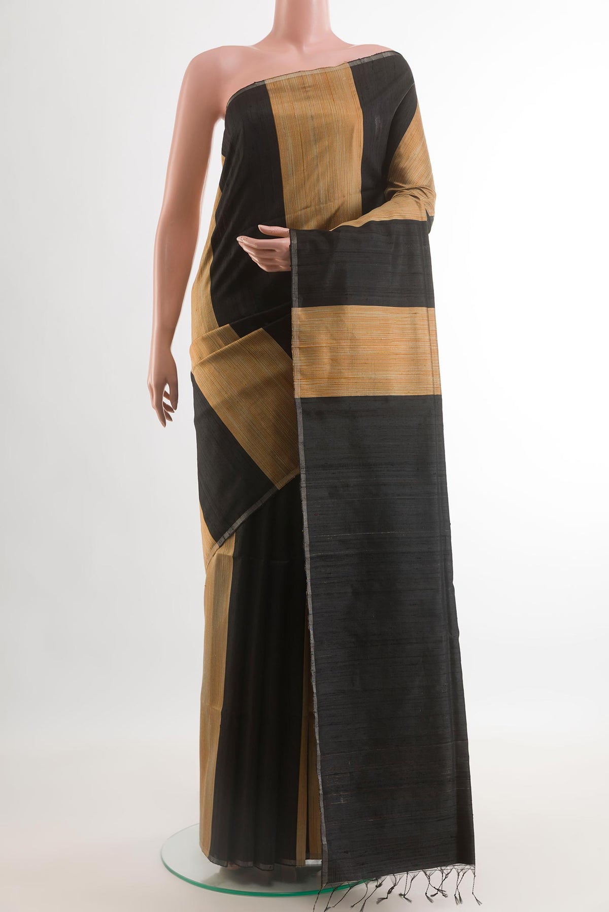 Black Tussar Saree with Stripes on the body and Zari Border.  displayed on a mannequin