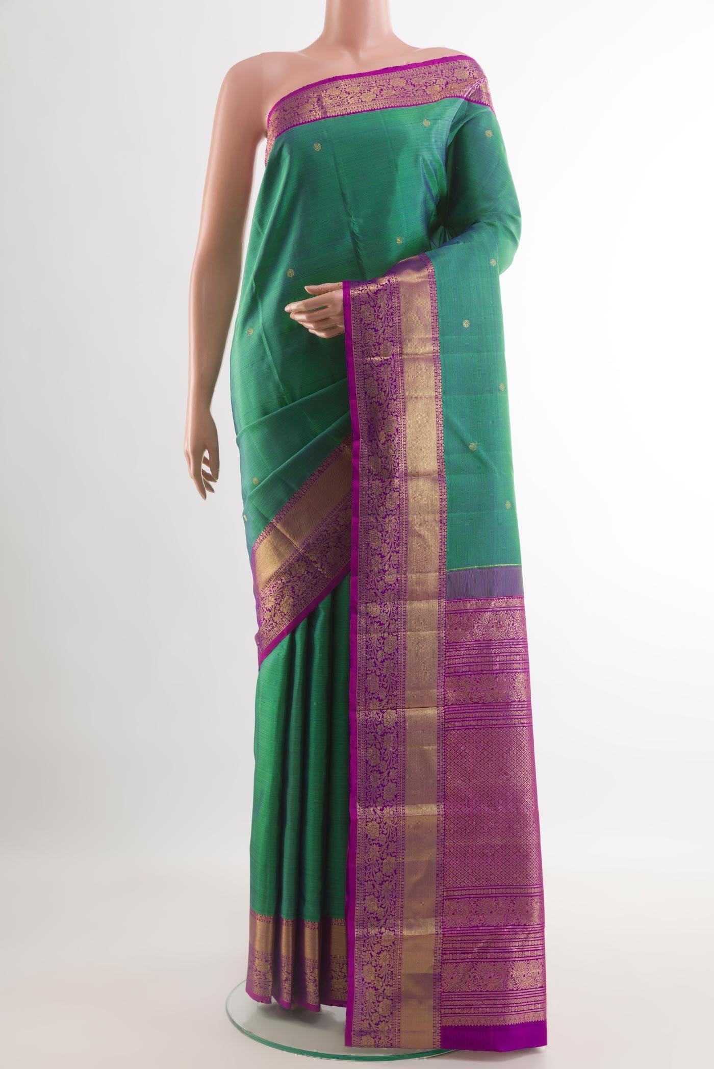 Sea Green Dual Tone Kanchipuram Silk Saree with Zari Butta on the body and Zari Border.  displayed on a mannequin
