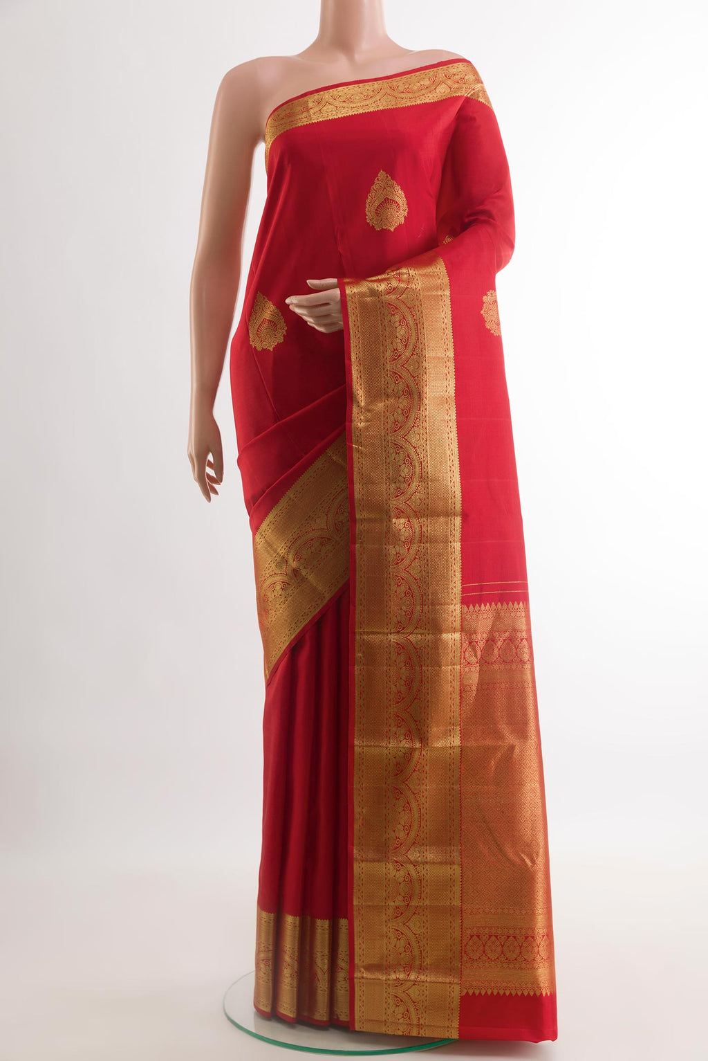 Red Kanchipuram Silk Saree with Zari Butta on the body and Zari Border.  displayed on a mannequin