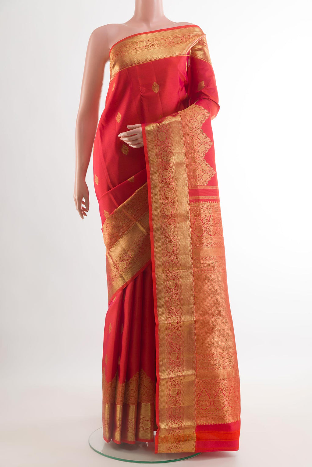 Red Kanchipuram Silk Saree with Zari Butta on the body and Zari Border.  displayed on a mannequin