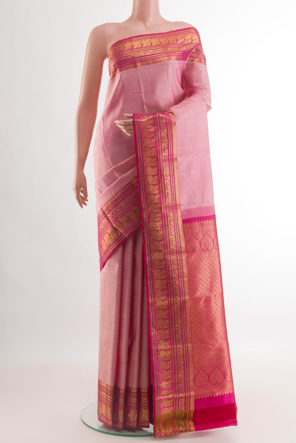 Rose pink Kanjivaram Silk Saree with Stripes on the body and Zari Border.  displayed on a mannequin