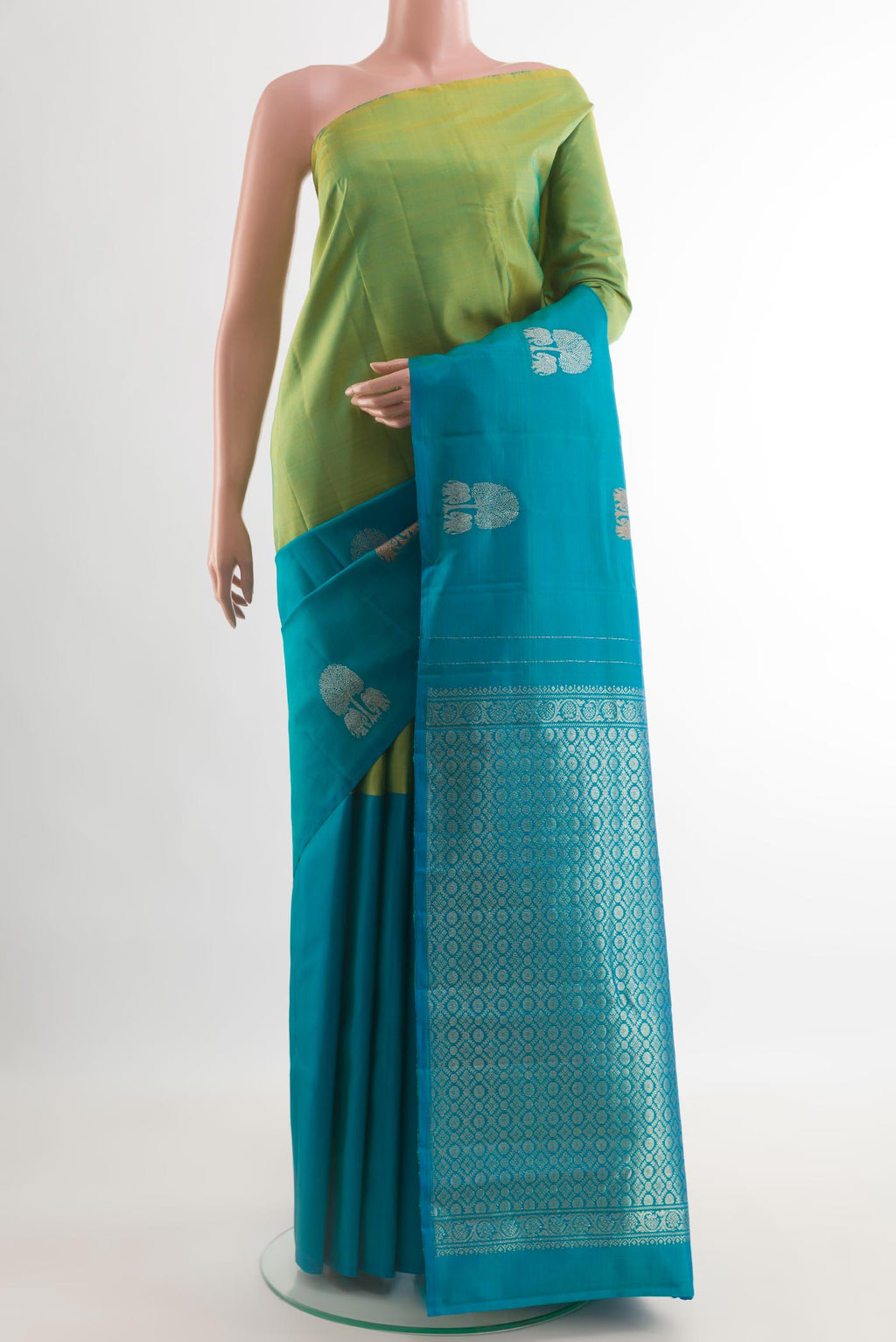 Multi Color Kanchipuram Silk Saree with Half And Half on the body and Without Border.  displayed on a mannequin