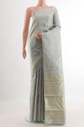 Grey Kanjivaram Silk Saree with Zari Butta on the body and Zari Border.  displayed on a mannequin