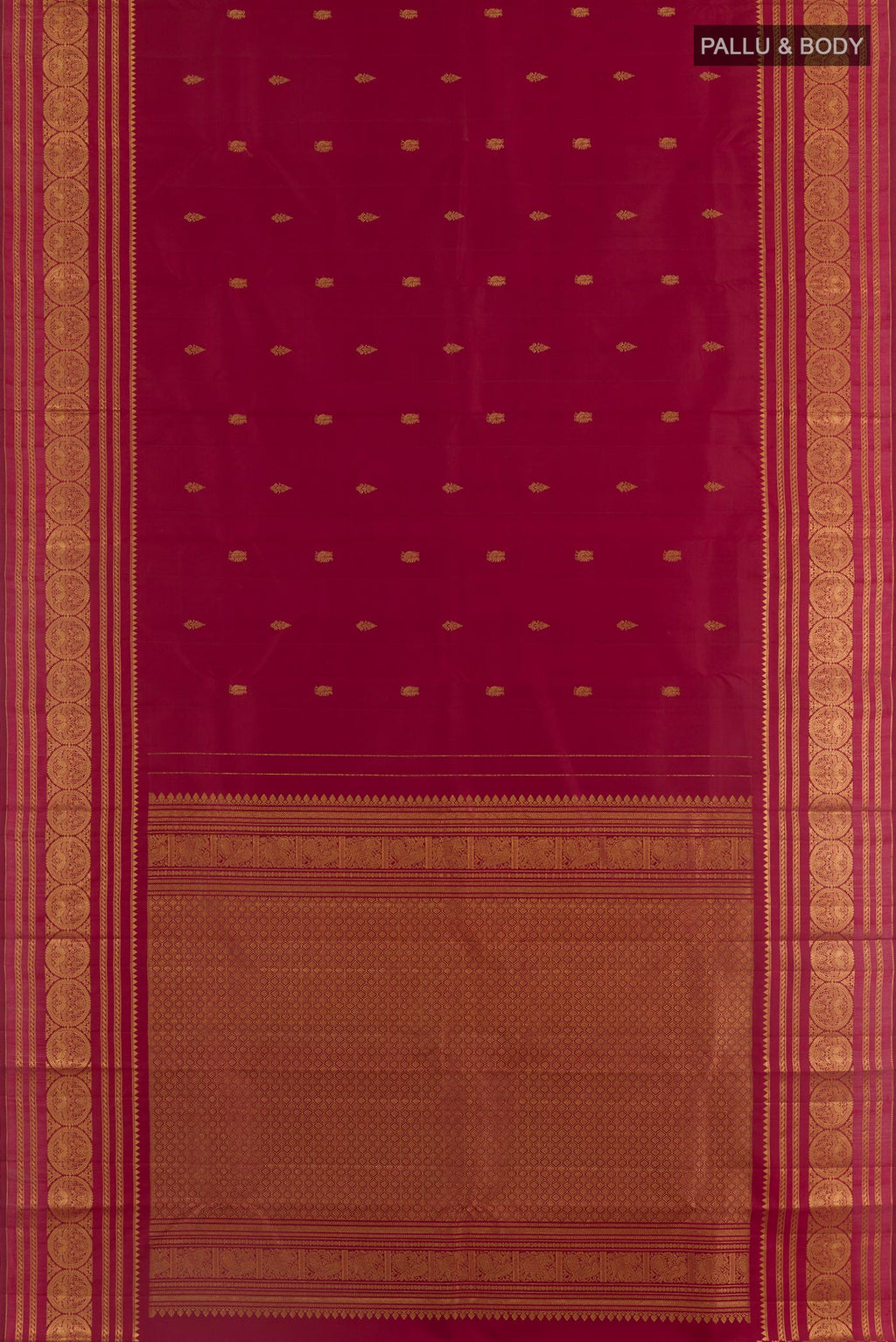 Flat view of Maroon Kanjivaram Silk Saree with Zari Butta on the body and Zari Border. 