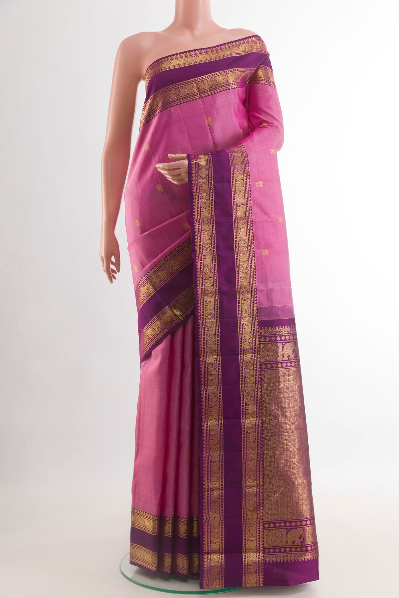 Pink Kanchipuram Silk Saree with Zari Butta on the body and Zari Border.  displayed on a mannequin