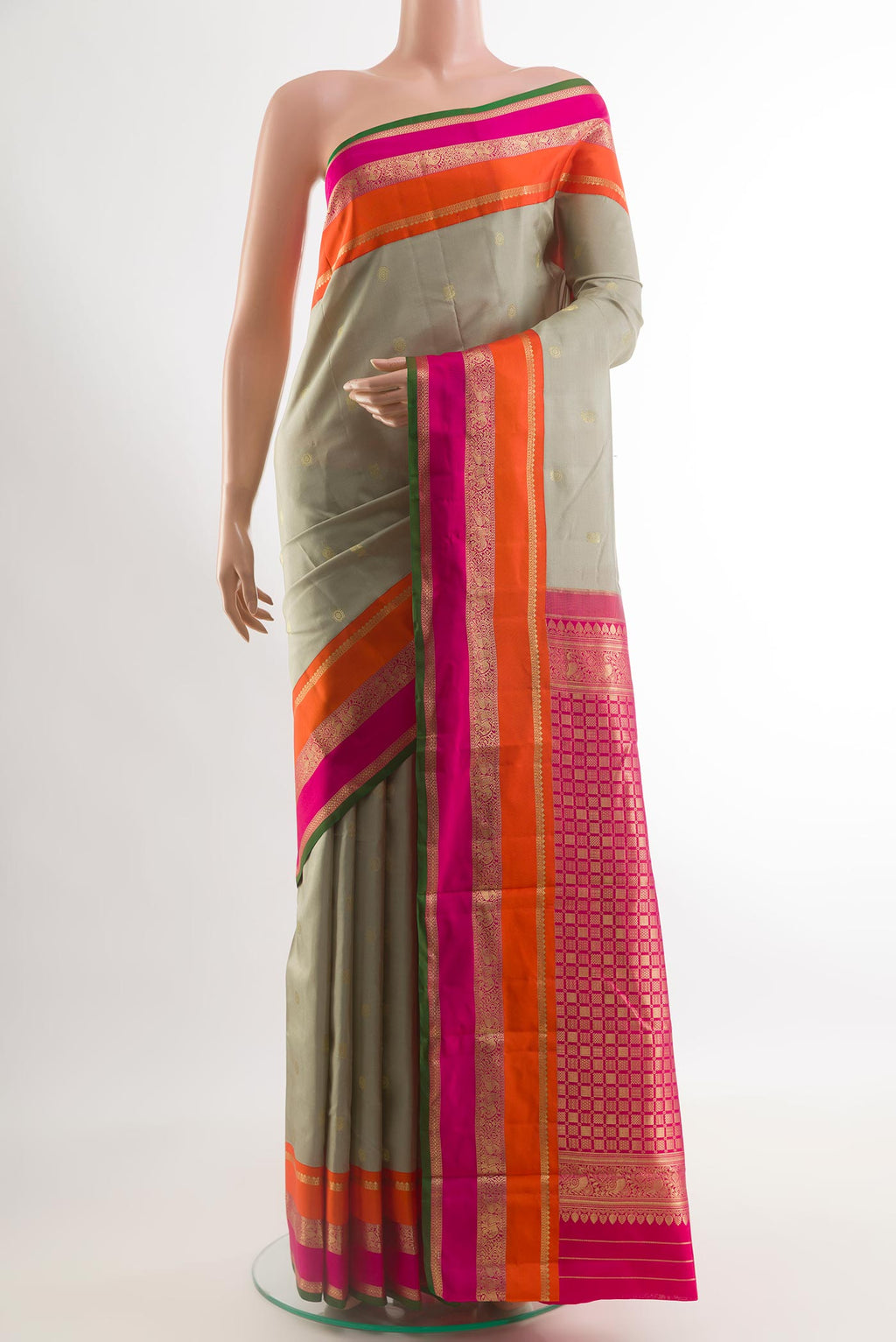 Grey Kanchipuram Silk Saree with Zari Butta on the body and Zari Border.  displayed on a mannequin