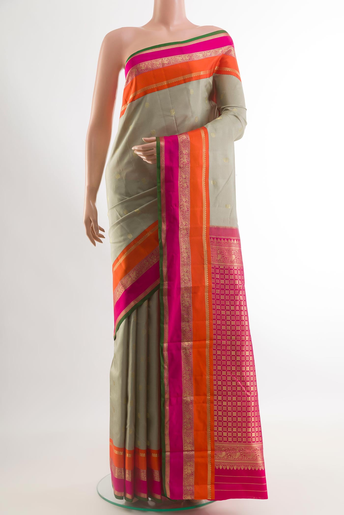Grey Kanchipuram Silk Saree with Zari Butta on the body and Zari Border.  displayed on a mannequin