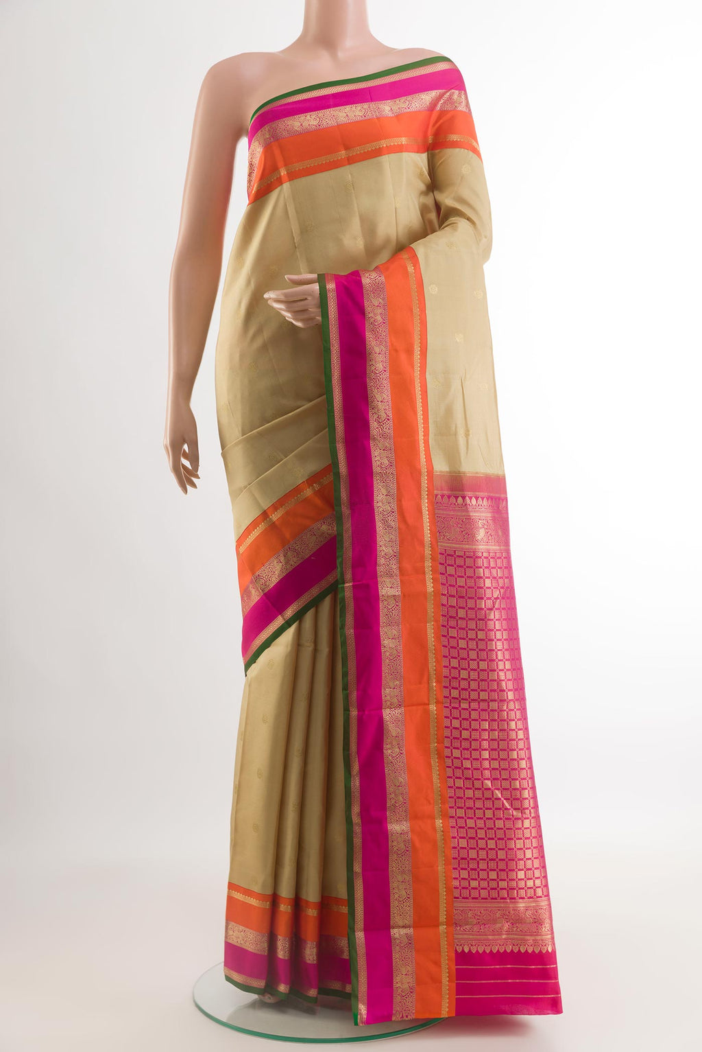 Beige Kanchipuram Silk Saree with Zari Butta on the body and Zari Border.  displayed on a mannequin