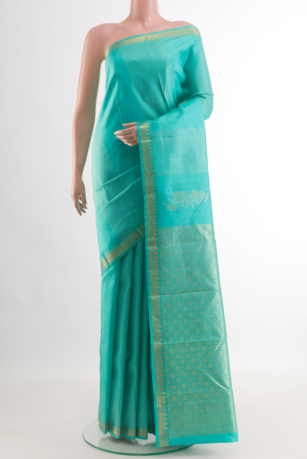 Light Blue Kanjivaram Silk Saree with Zari Butta on the body and Zari Border.  displayed on a mannequin