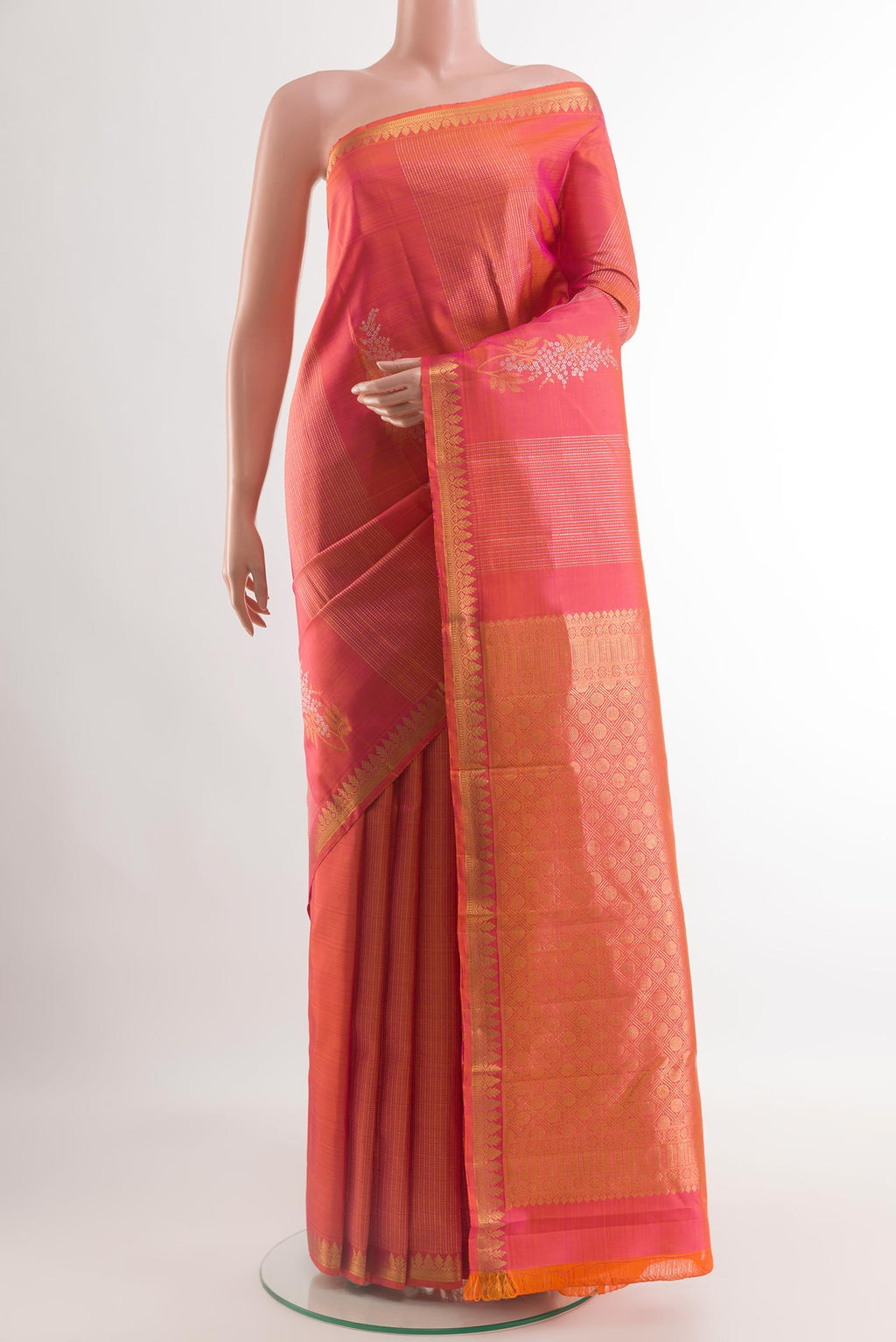 Coral Dual Tone Kanjivaram Silk Saree with Zari Butta on the body and Zari Border.  displayed on a mannequin