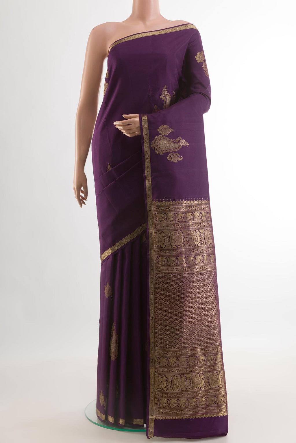 Purple Kanchipuram Silk Saree with Zari Butta on the body and Zari Border.  displayed on a mannequin