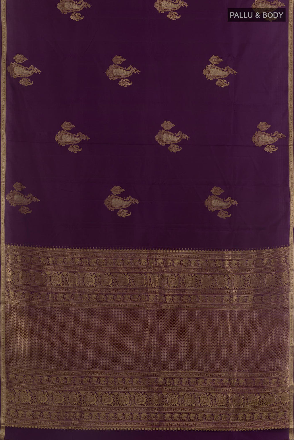 Flat view of Purple Kanchipuram Silk Saree with Zari Butta on the body and Zari Border. 