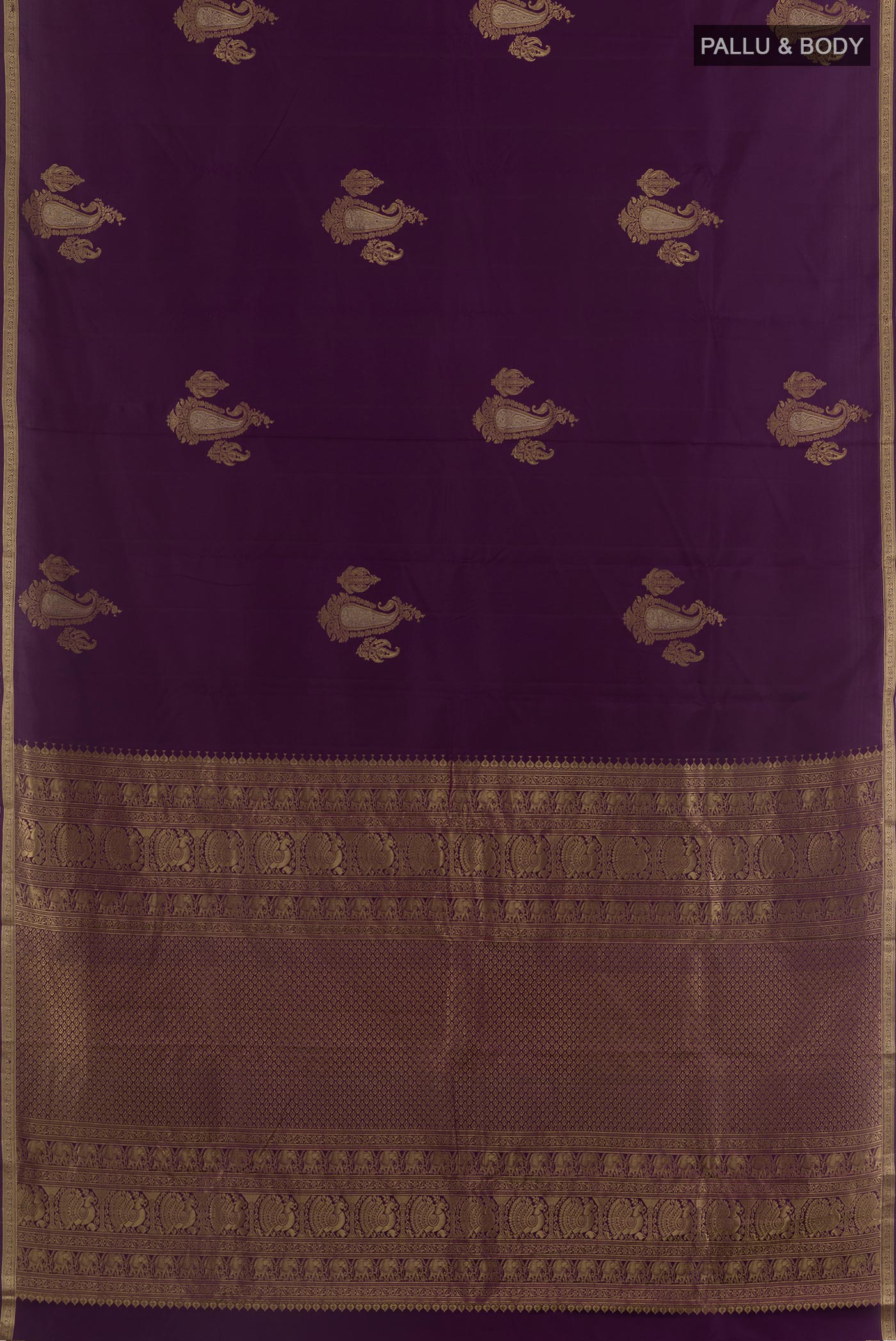 Flat view of Purple Kanchipuram Silk Saree with Zari Butta on the body and Zari Border. 