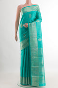 Blue Kanchipuram Silk Saree with Zari Butta on the body and Zari Border.  displayed on a mannequin