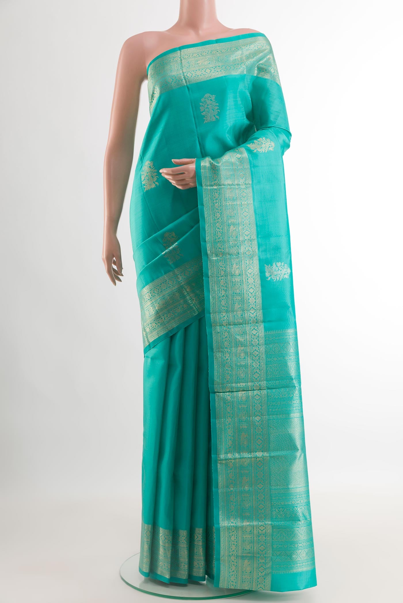 Blue Kanchipuram Silk Saree with Zari Butta on the body and Zari Border.  displayed on a mannequin