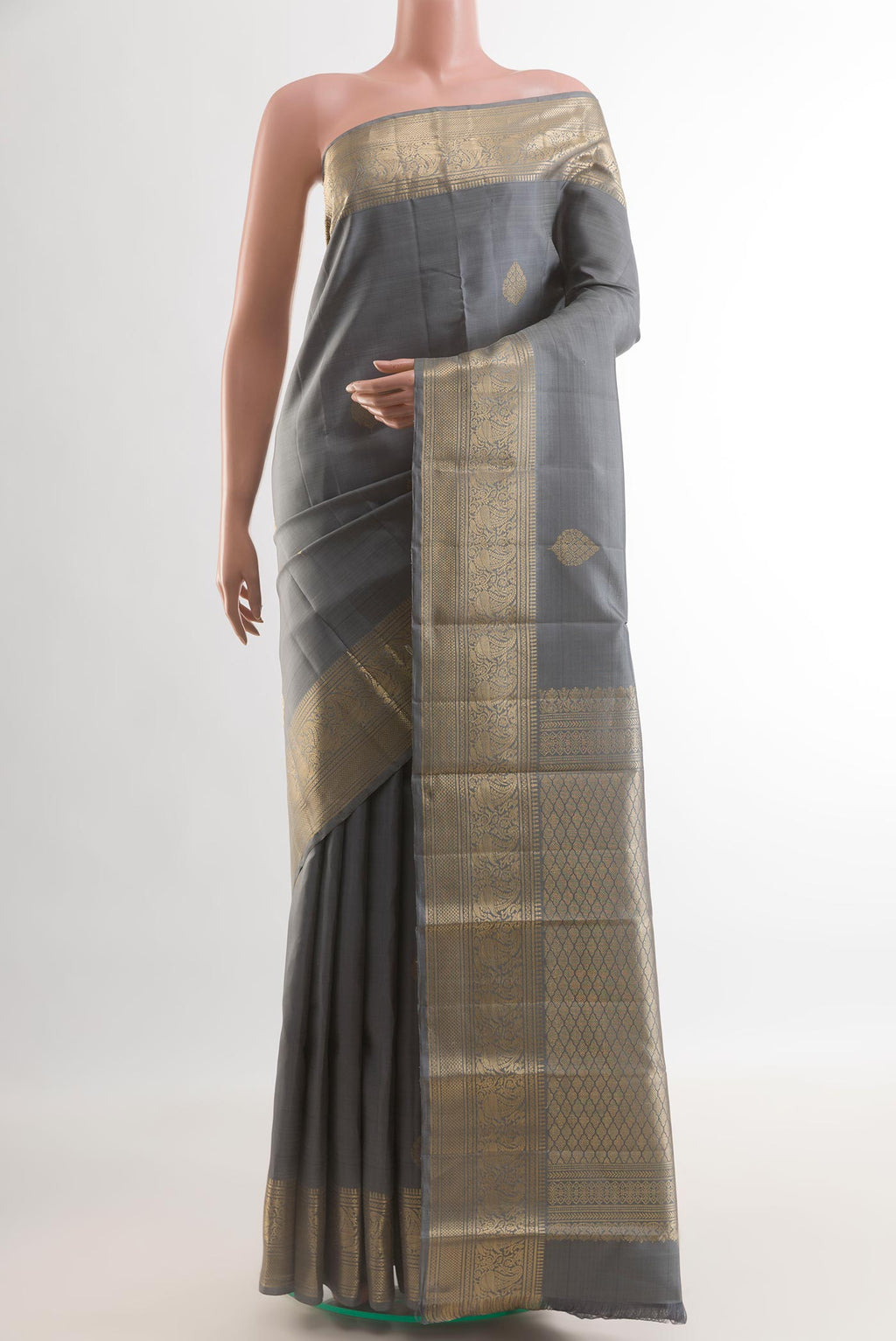 Grey Kanchipuram Silk Saree with Zari Butta on the body and Zari Border.  displayed on a mannequin