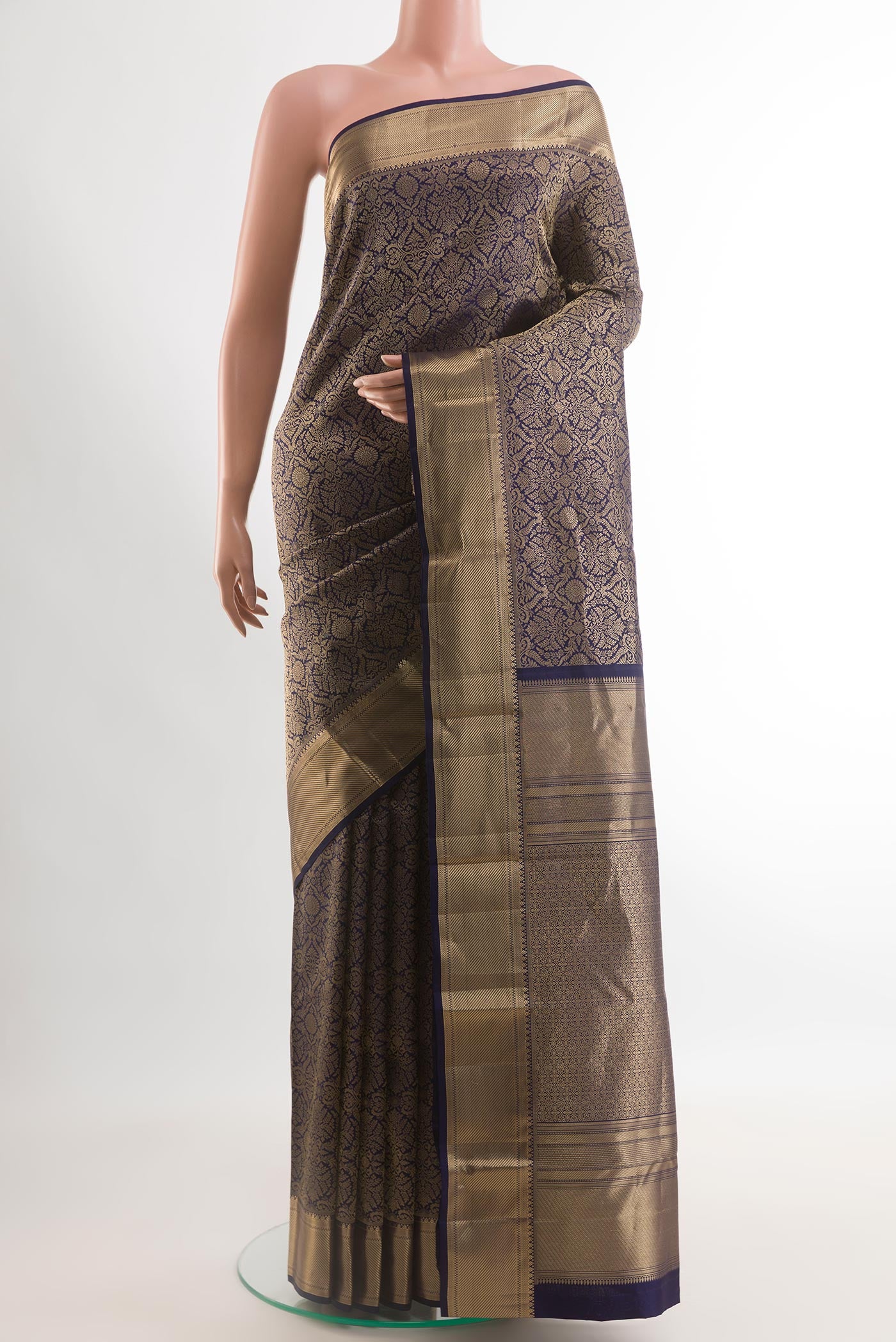 Navy Blue Kanchipuram Silk Saree with Zari Brocade on the body and Zari Border.  displayed on a mannequin