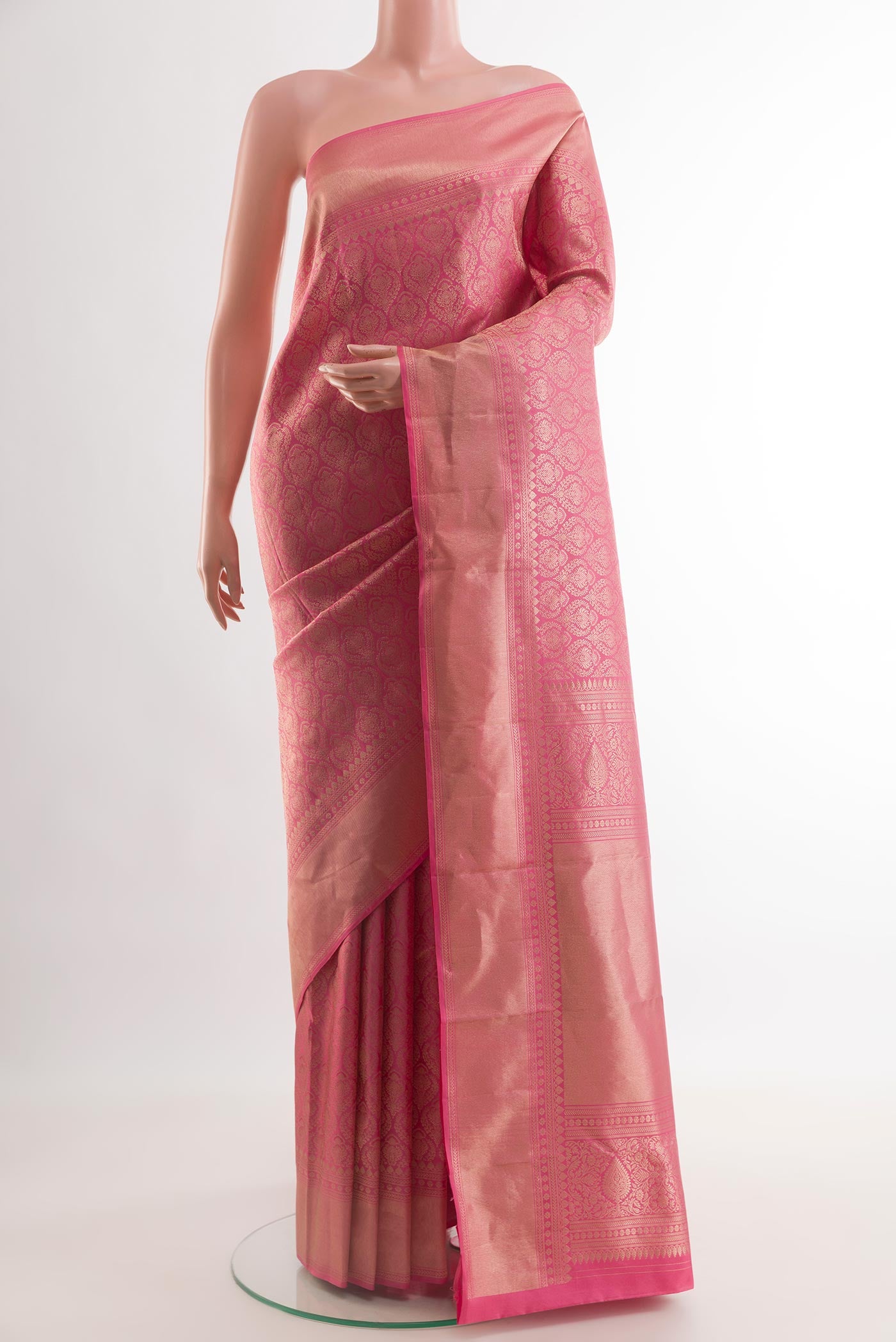 Pink Kanchipuram Silk Saree with Zari Brocade on the body and Zari Border.  displayed on a mannequin