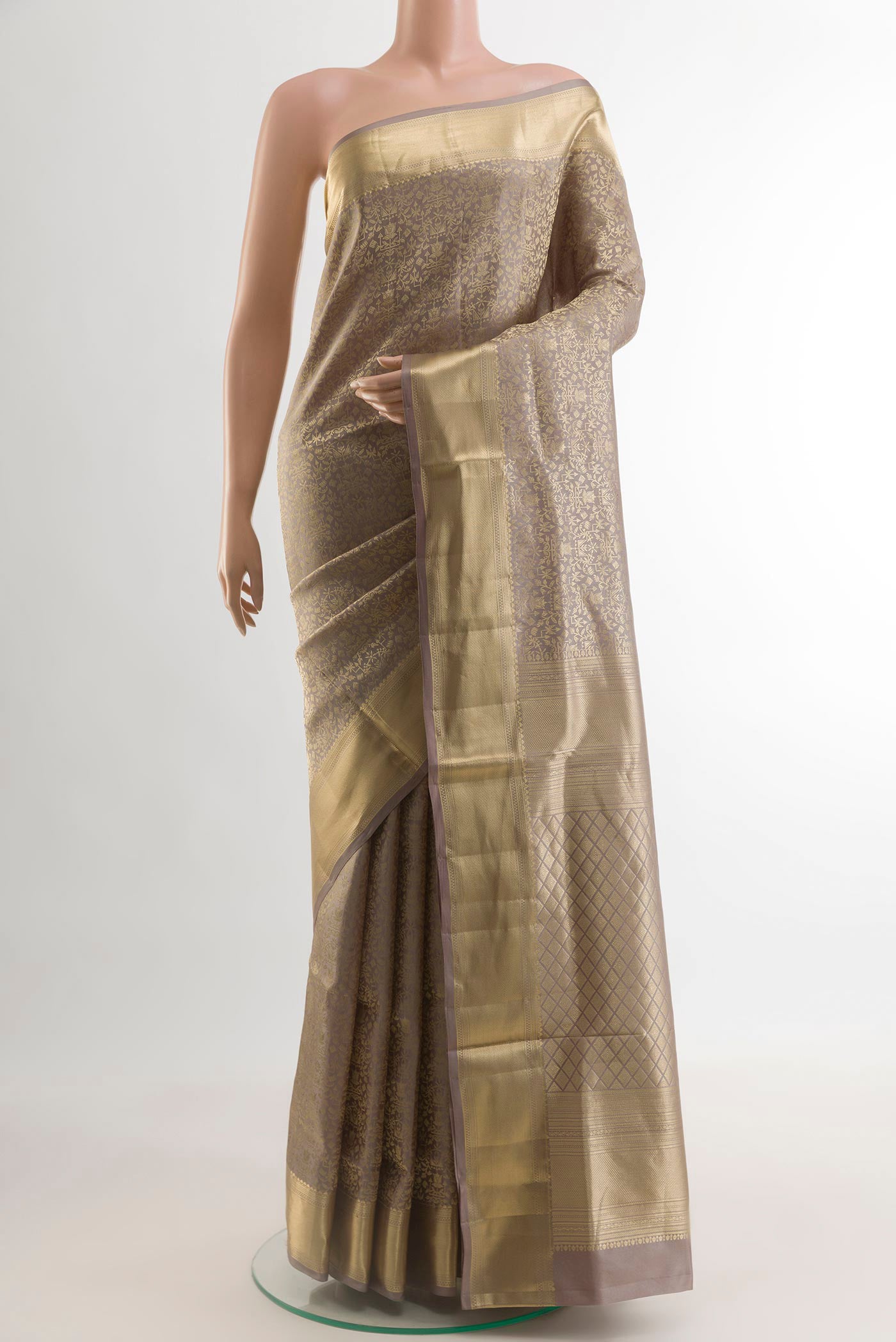 Grey Soft Silk Saree with Zari Brocade on the body and Zari Border.  displayed on a mannequin
