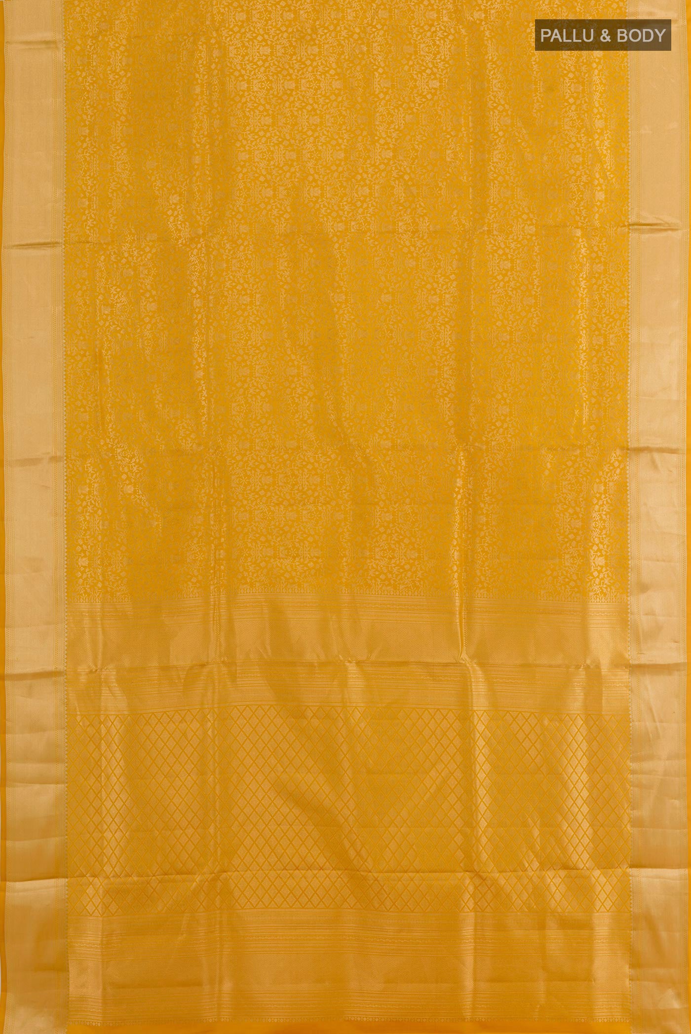 Flat view of Mustard Soft Silk Saree with Zari Brocade on the body and Zari Border. 