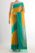 Pure Silk Yellow Soft Saree with Zari Butta on the body and Zari Border.  displayed on a mannequin