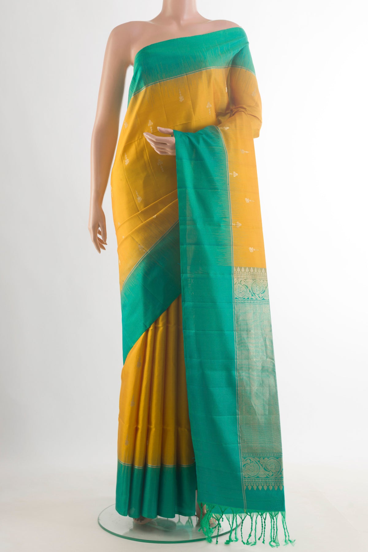 Pure Silk Yellow Soft Saree with Zari Butta on the body and Zari Border.  displayed on a mannequin