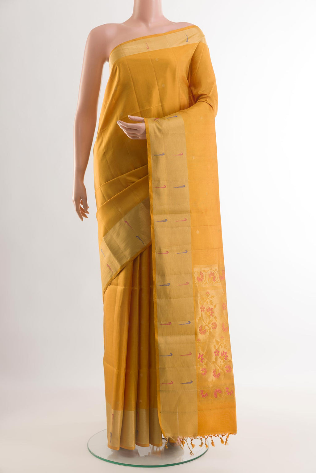 Yellow Soft Silk Saree with Zari Butta on the body and Zari Border.  displayed on a mannequin