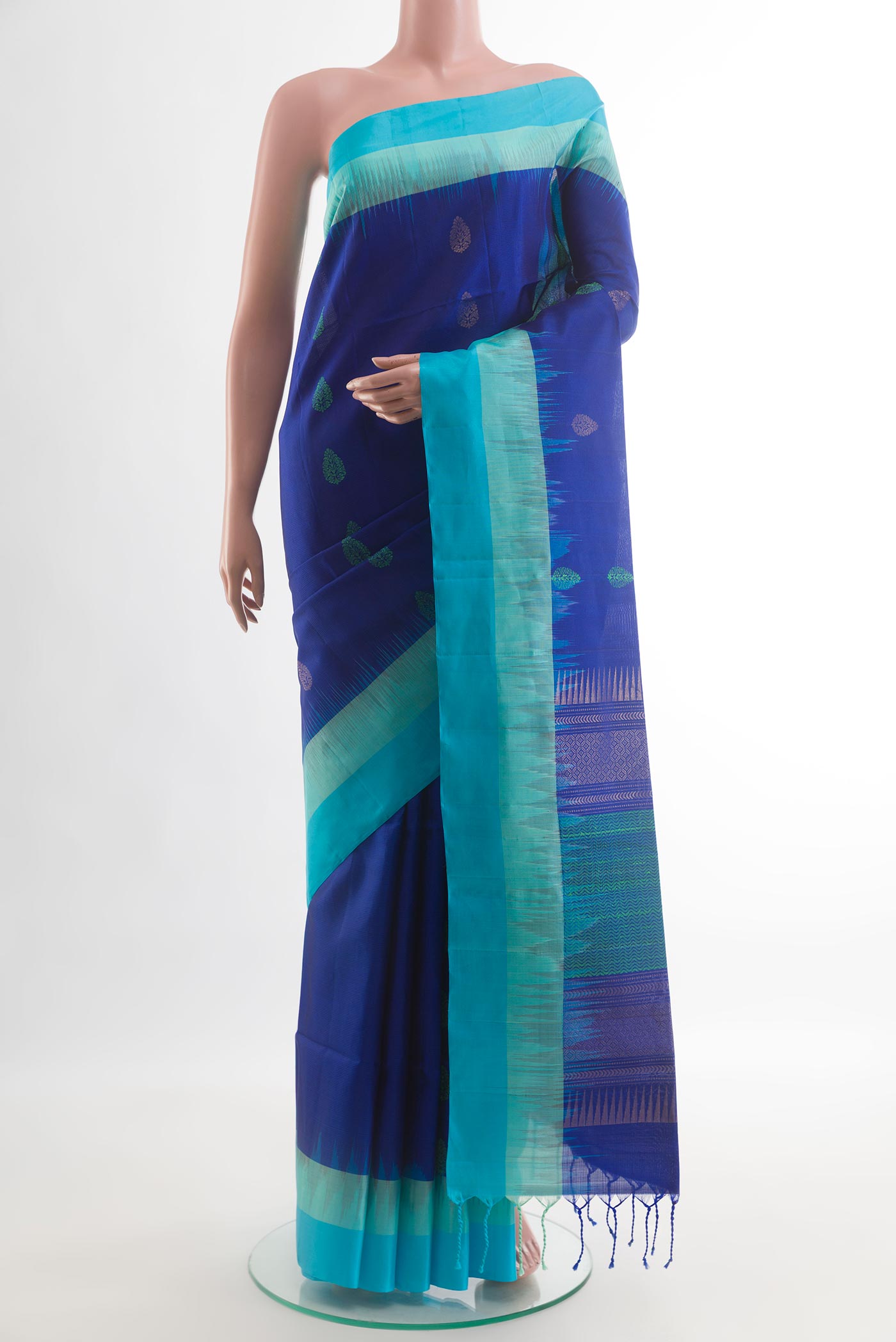 Blue Soft Silk Saree with Zari And Thread Butta on the body and Zari Border.  displayed on a mannequin