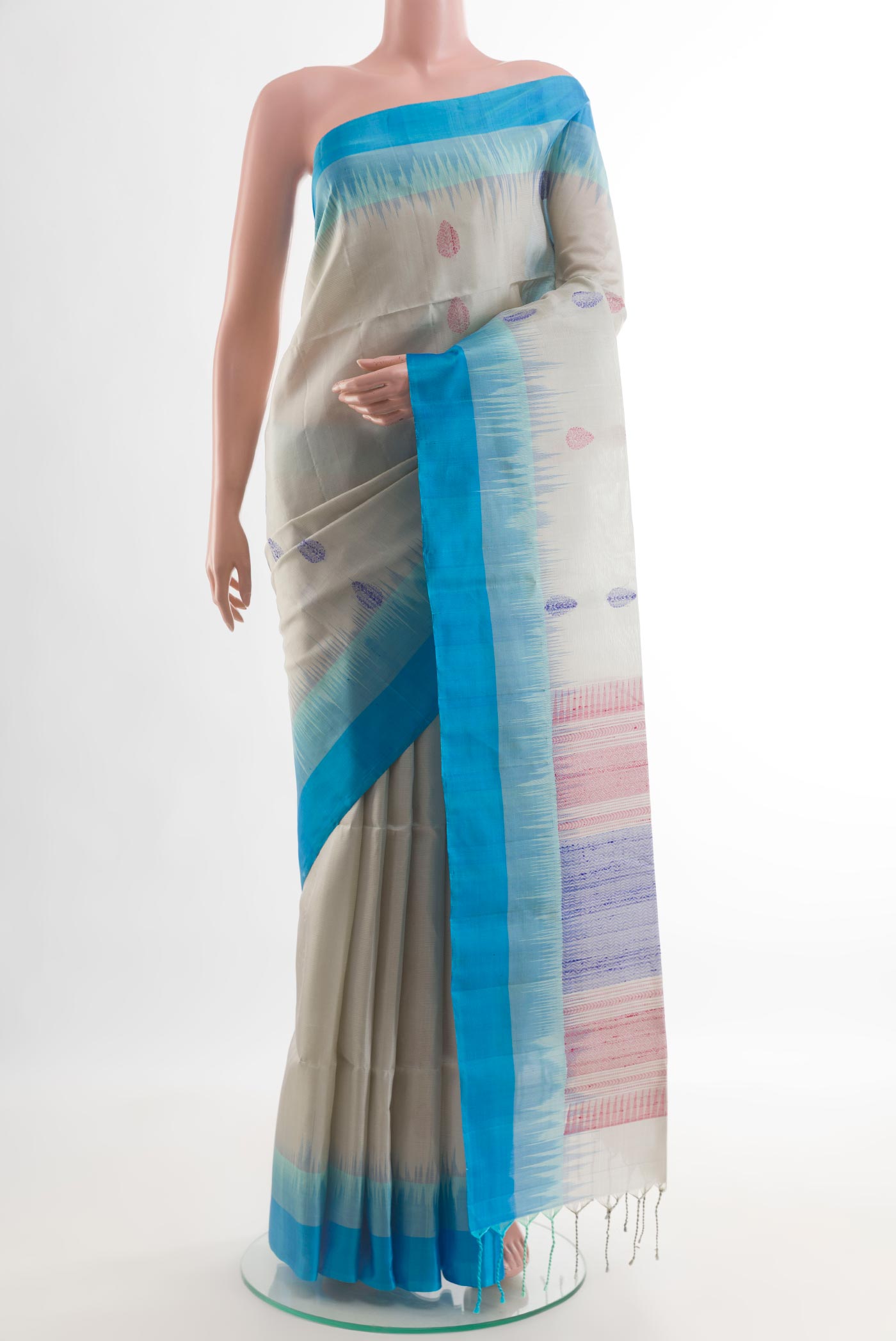 Grey Soft Silk Saree with Zari And Thread Butta on the body and Zari Border.  displayed on a mannequin