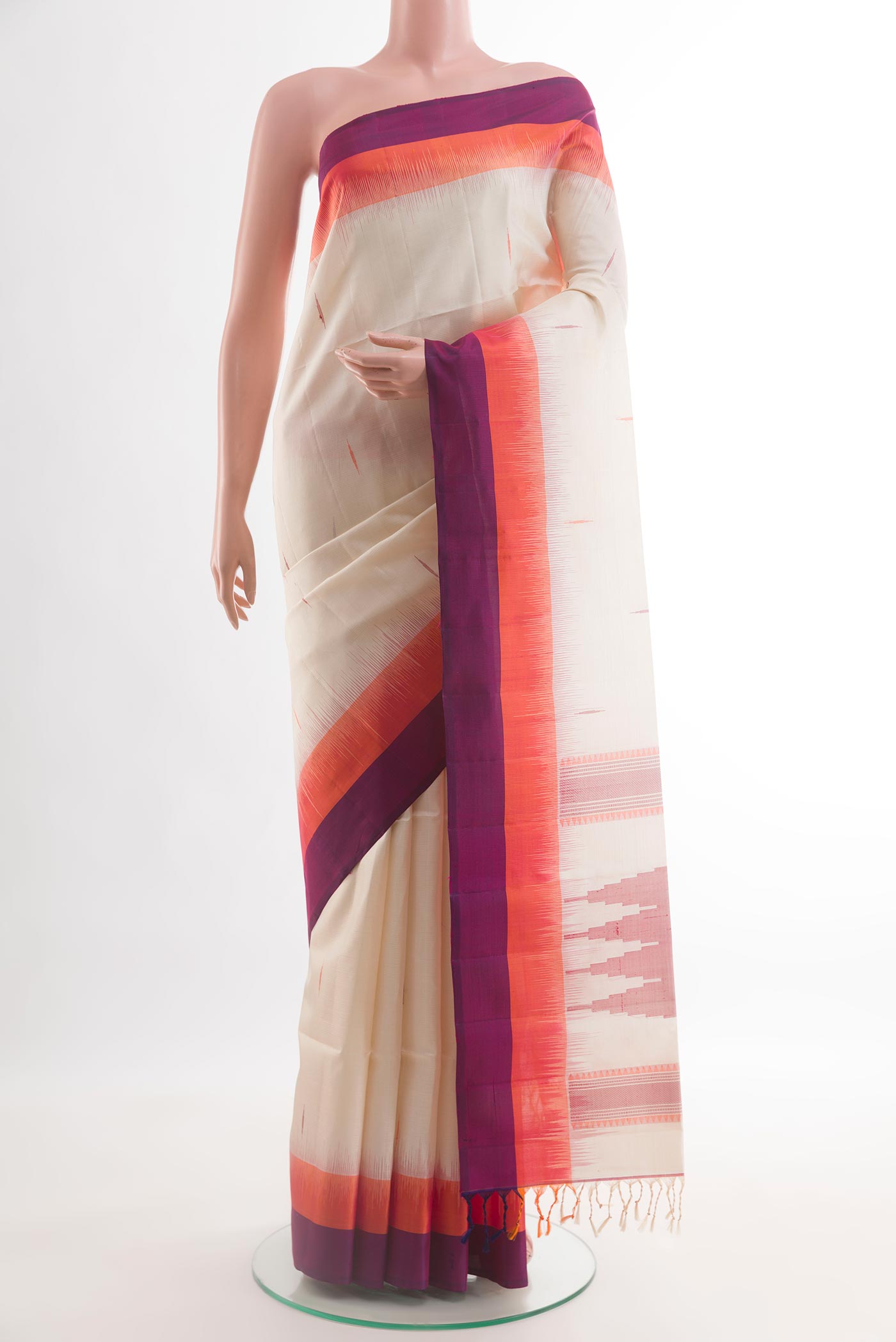 Off White Soft Silk Saree with Thread Butta on the body and Zari Border.  displayed on a mannequin