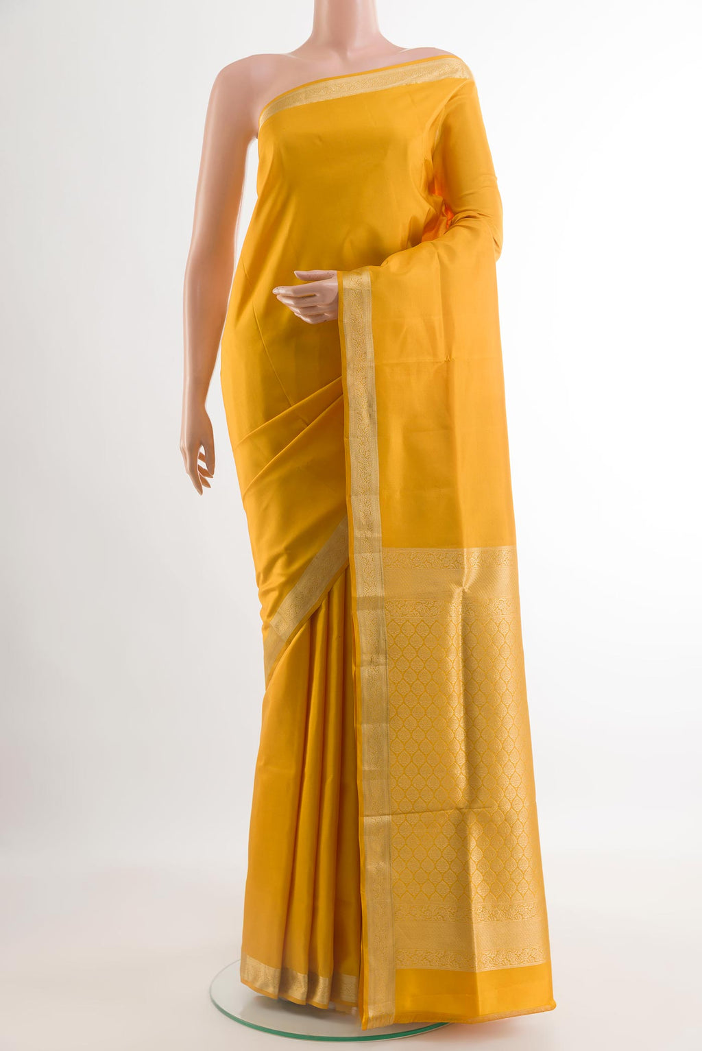 Yellow Soft Silk Saree with Plain Body and Zari Border.  displayed on a mannequin