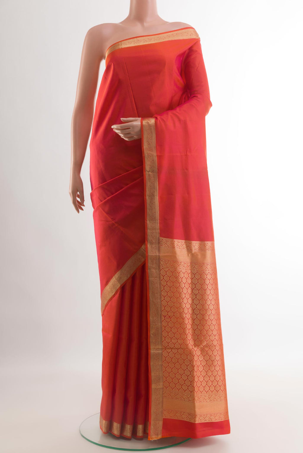 Brick Orange Dual Tone Soft Silk Saree with Plain Body and Zari Border.  displayed on a mannequin