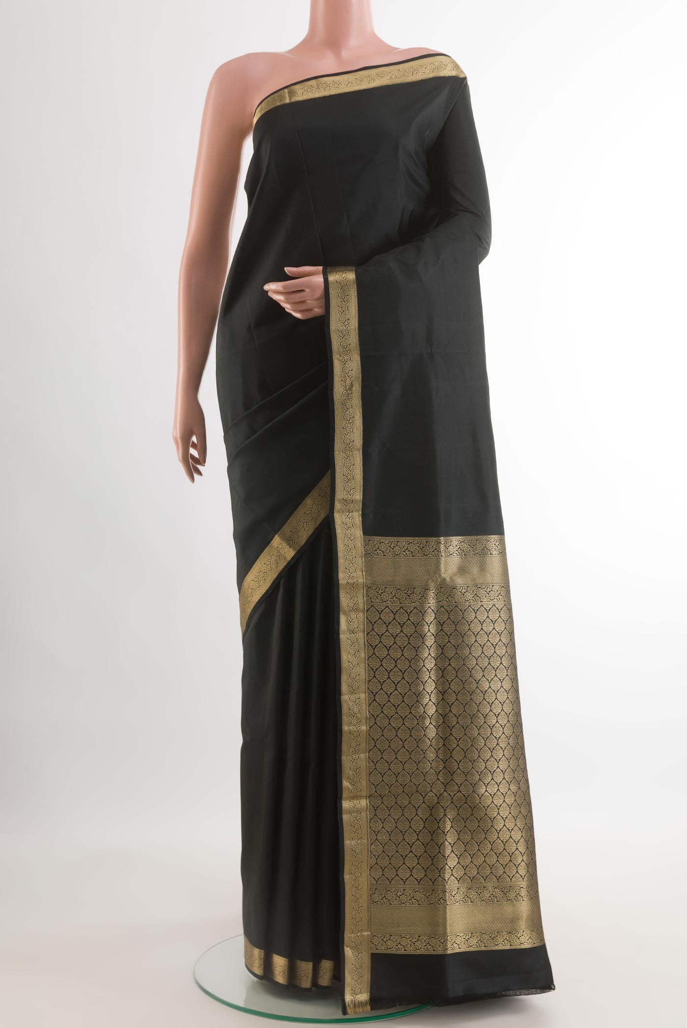 Black Soft Silk Saree with Plain Body and Zari Border.  displayed on a mannequin