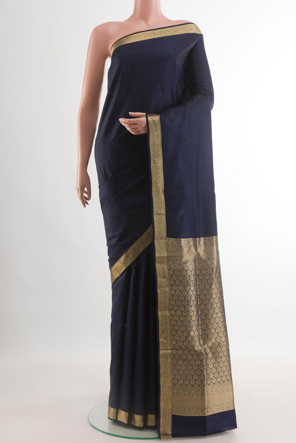 Navy Blue Soft Silk Saree with Plain Body and Zari Border.  displayed on a mannequin