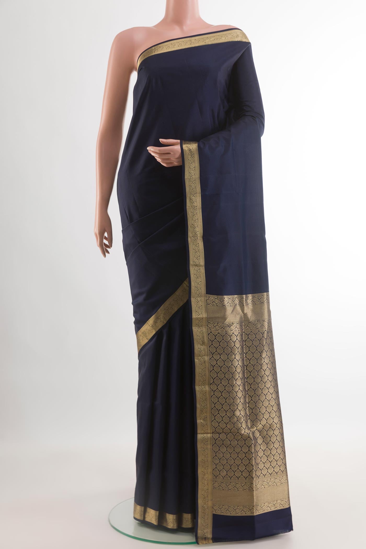 Navy Blue Soft Silk Saree with Plain Body and Zari Border.  displayed on a mannequin