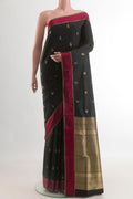 Black Soft Silk Saree with Zari Butta on the body and Thread Border.  displayed on a mannequin