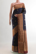 Navy Blue Soft Silk Saree with Zari Butta on the body and Zari Border.  displayed on a mannequin