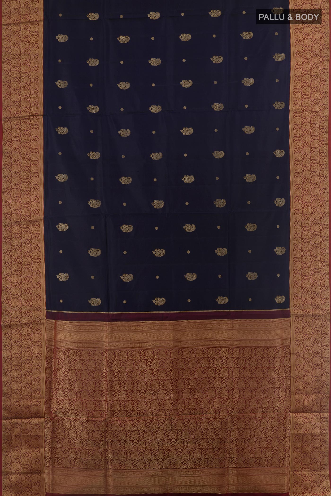 Flat view of Navy Blue Soft Silk Saree with Zari Butta on the body and Zari Border. 
