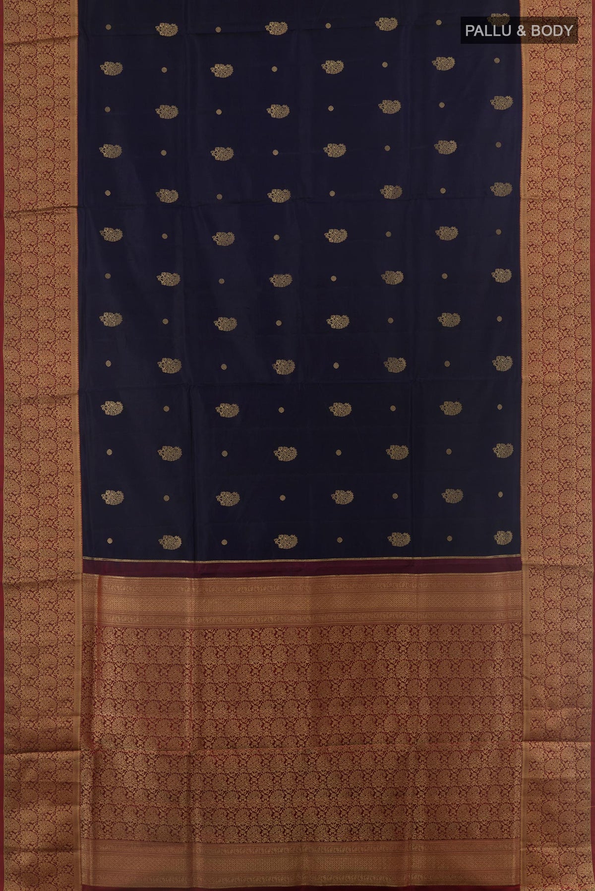 Flat view of Navy Blue Soft Silk Saree with Zari Butta on the body and Zari Border. 
