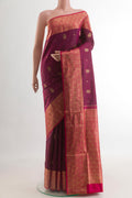 Maroon Soft Silk Saree with Zari Butta on the body and Zari Border.  displayed on a mannequin