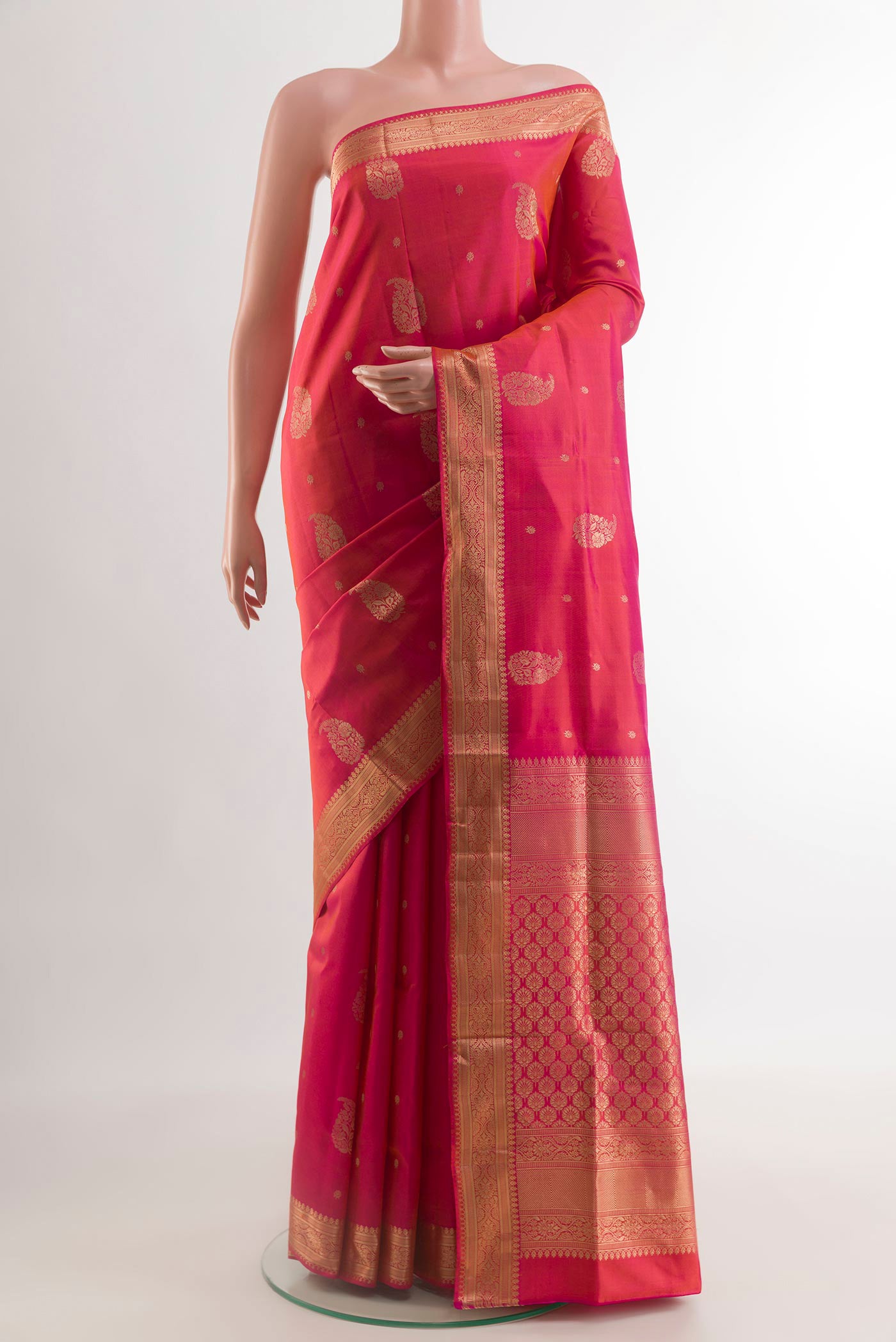 Pink Soft Silk Saree with Zari Butta on the body and Zari Border.  displayed on a mannequin