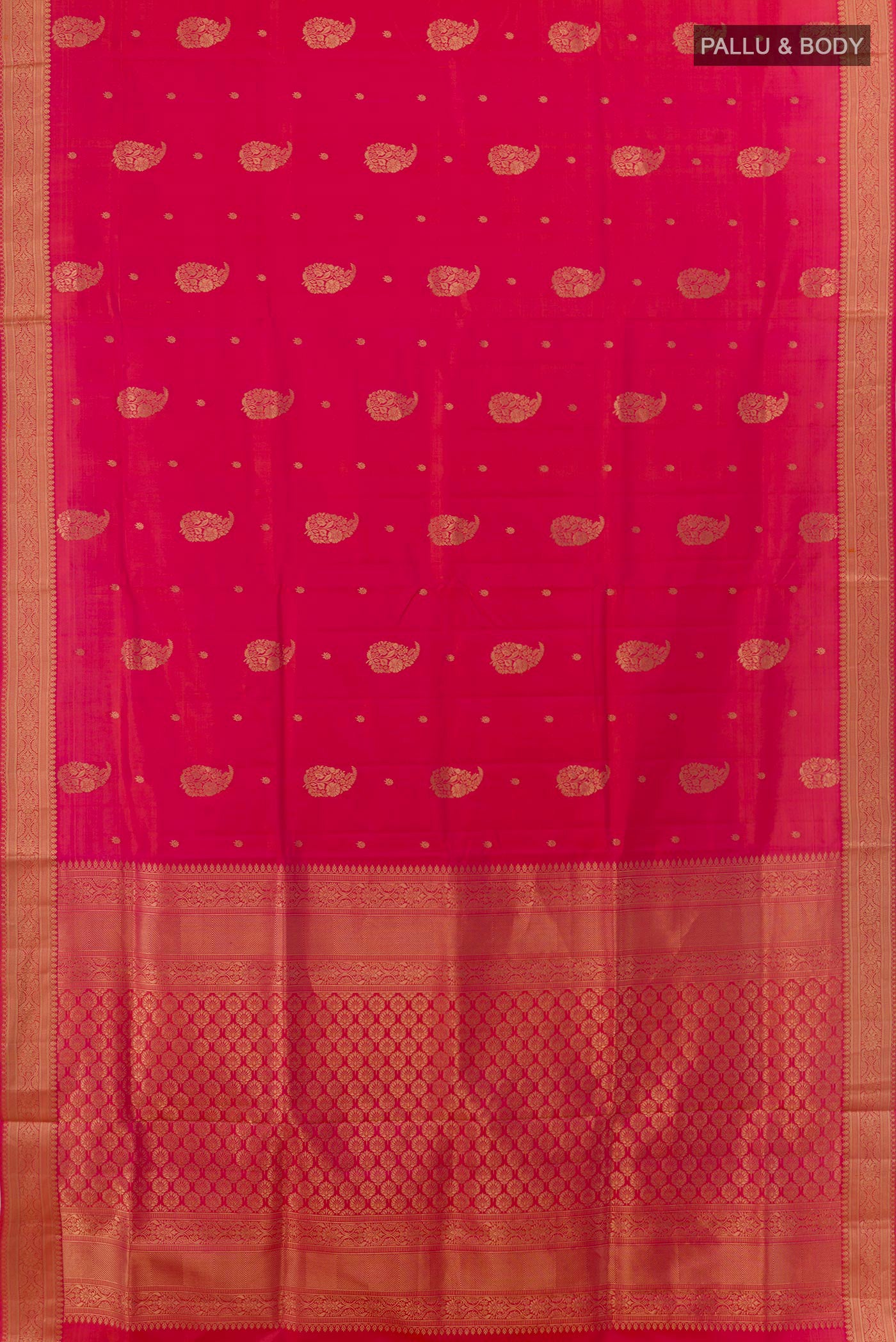 Flat view of Pink Soft Silk Saree with Zari Butta on the body and Zari Border. 