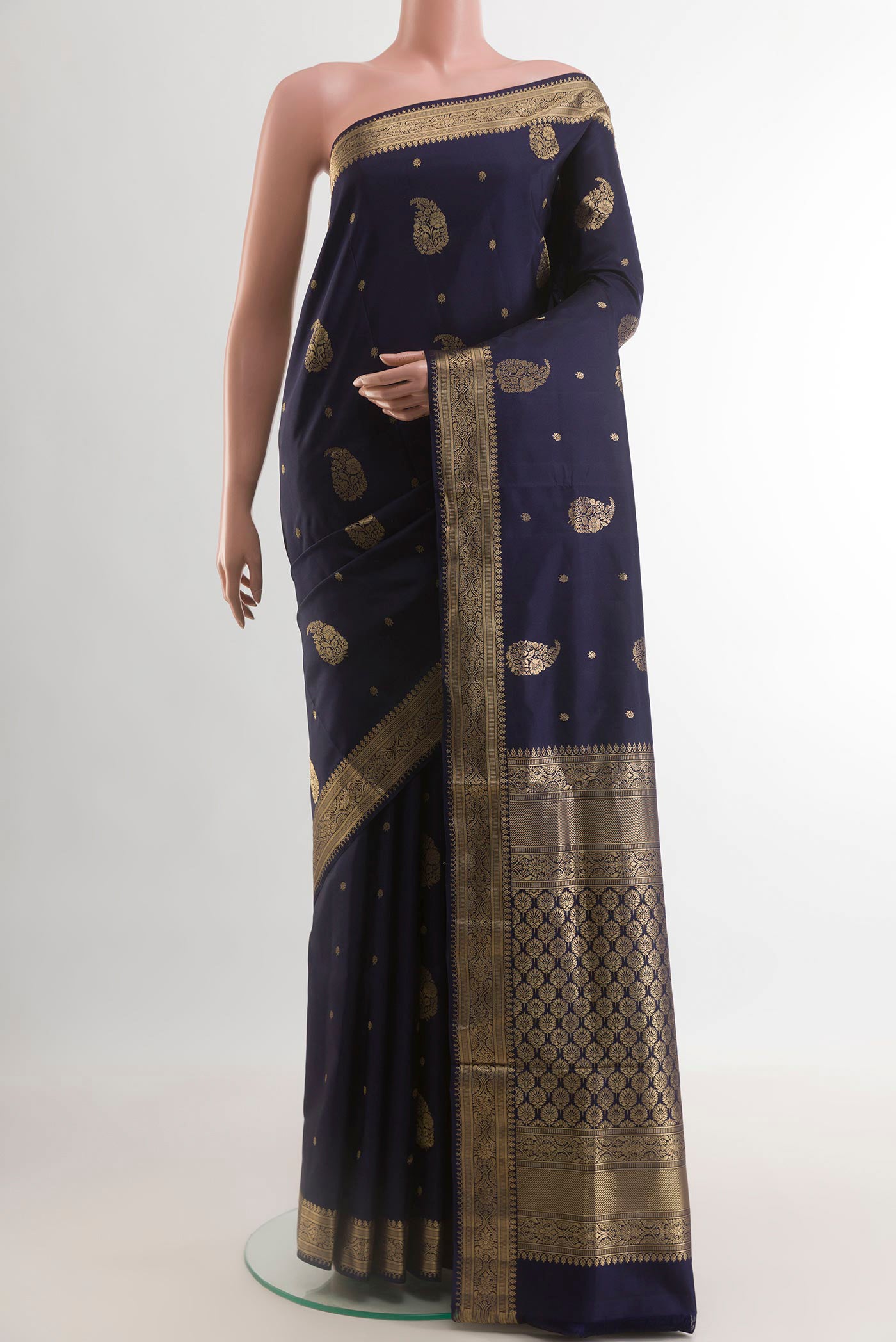 Navy Blue Soft Silk Saree with Zari Butta on the body and Zari Border.  displayed on a mannequin