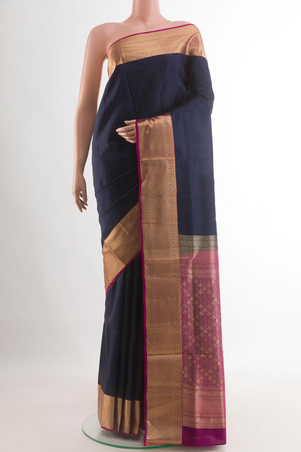 Navy Blue Soft Silk Saree with Plain Body and Zari Border.  displayed on a mannequin