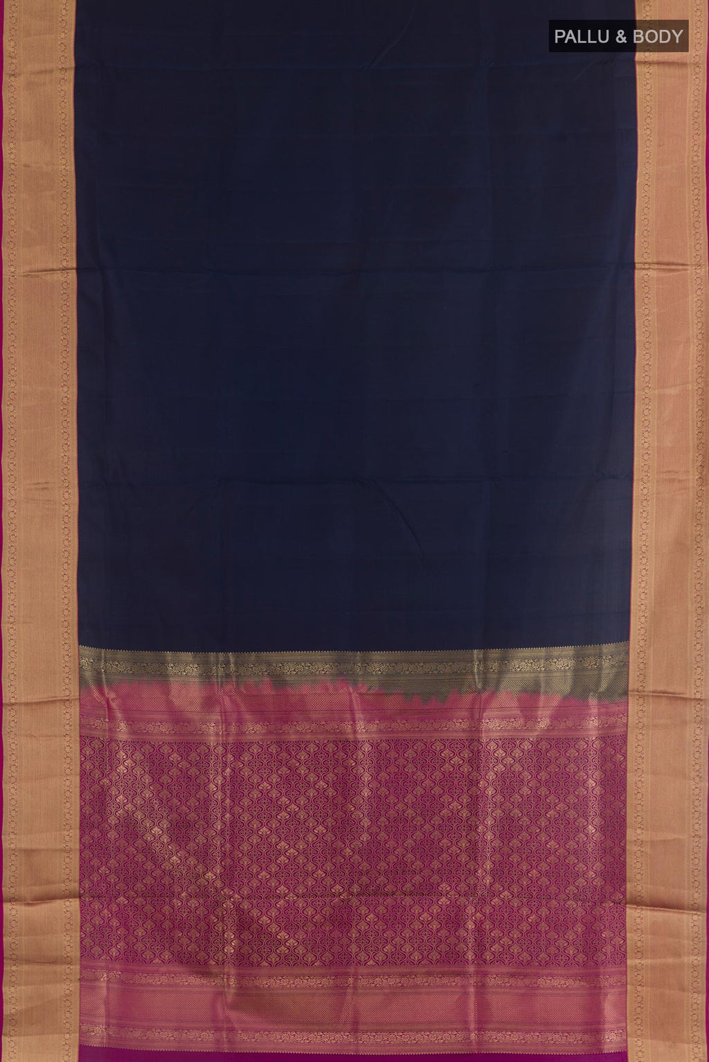 Flat view of Navy Blue Soft Silk Saree with Plain Body and Zari Border. 