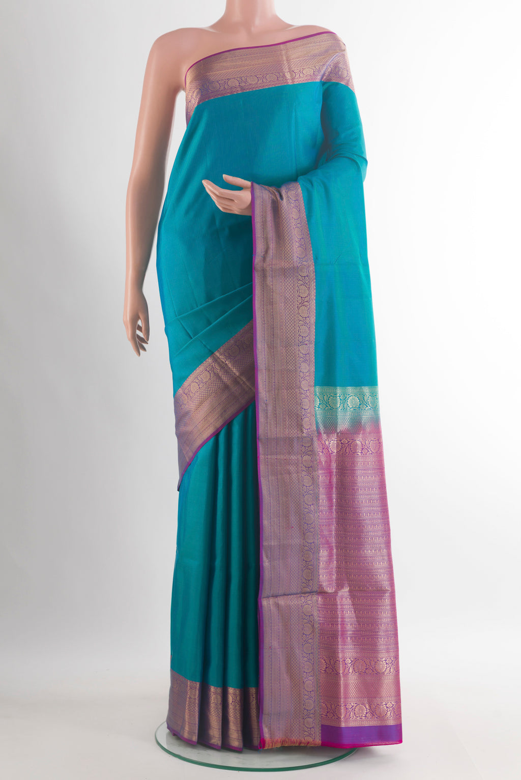 Pure Silk Turquoise Soft Saree with Plain Body and Zari Border.  displayed on a mannequin