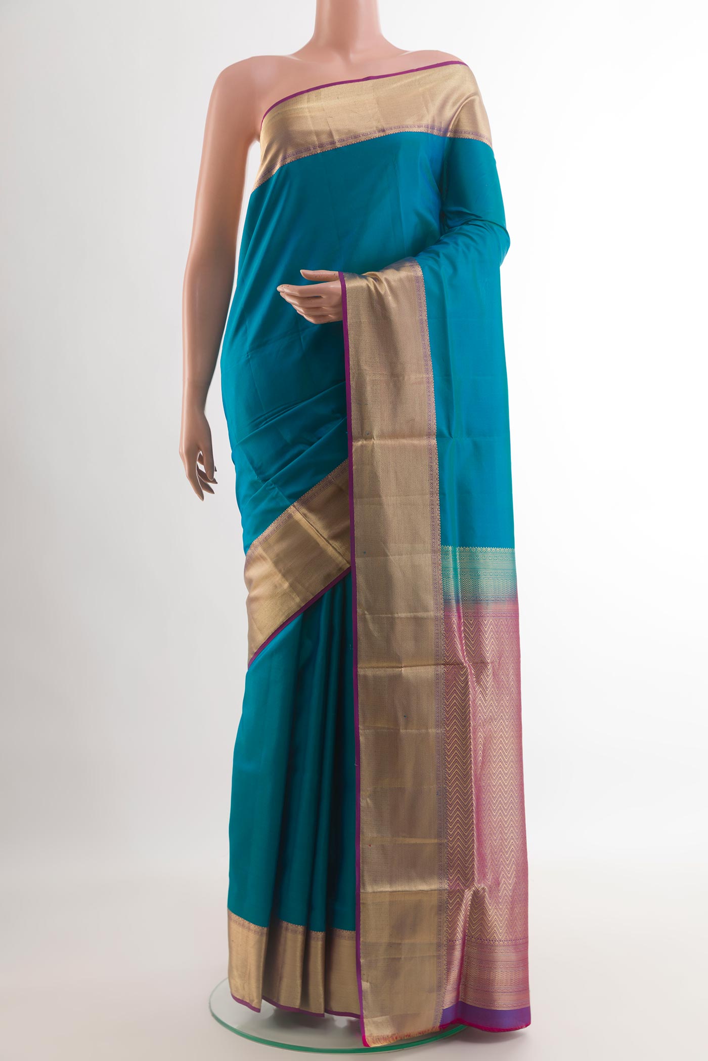 Blue Soft Silk Saree with Plain Body and Zari Border.  displayed on a mannequin